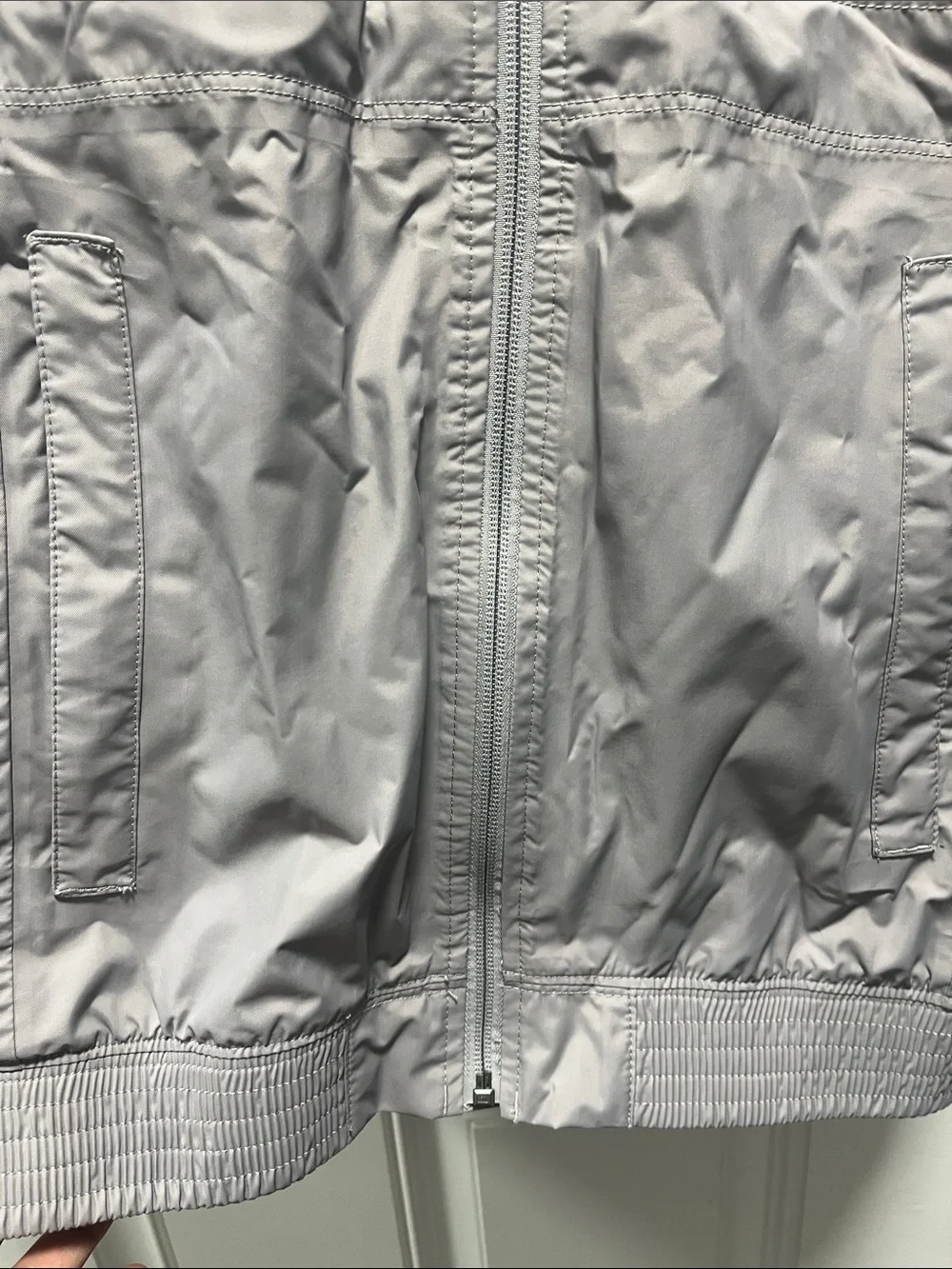 The North Face Light Gray women’s' Hooded Rain Jacket